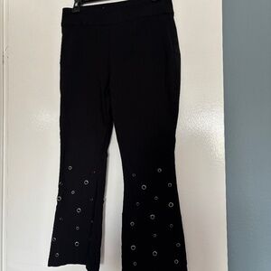 Wmn size 8, INC, pull on, stretch, black FLARE pants w/GROMMETs by front hem.